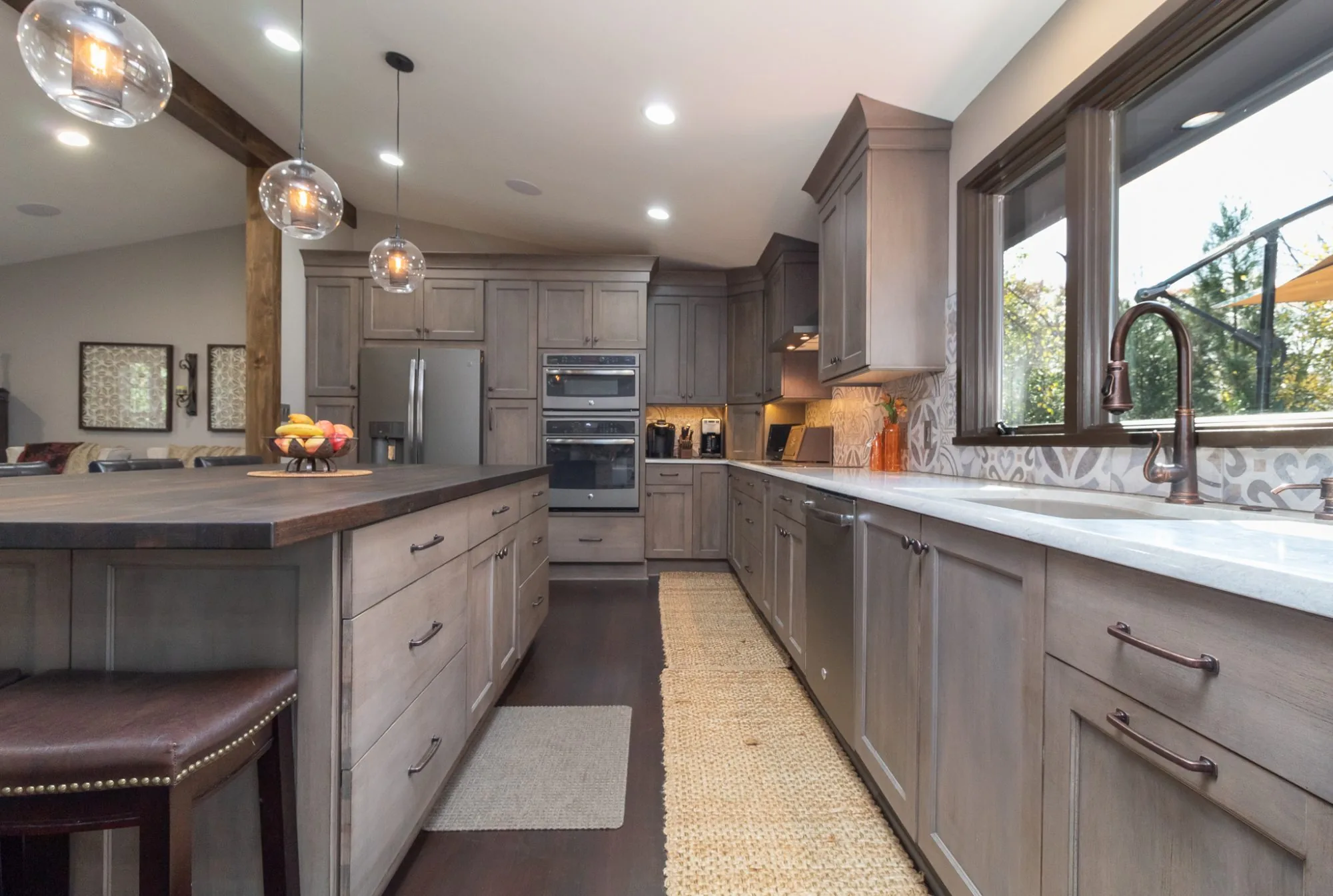 Grey stained cabinetry with wood counters
